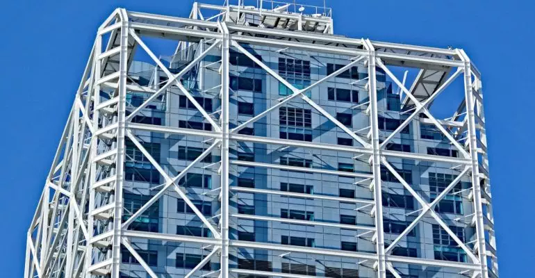 A clock-topped tall building in Spain sells briskly.