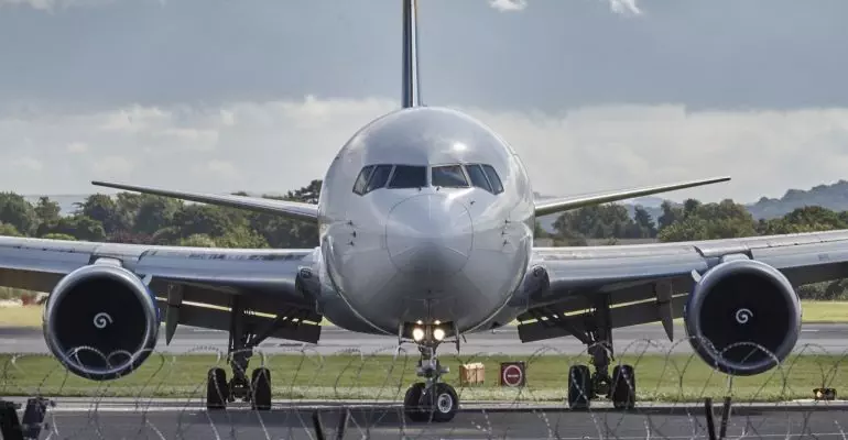 Airlines companies in Spain operate a large airplane on the tarmac.