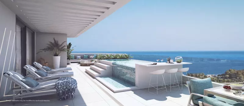 A rendering of a balcony with lounge chairs and a view of the ocean.