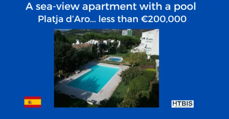 Image of an apartment complex with a sea view and swimming pool, located in Platja d'Aro, Spain. This Costa Brava property for sale is advertised for less than €200,000.