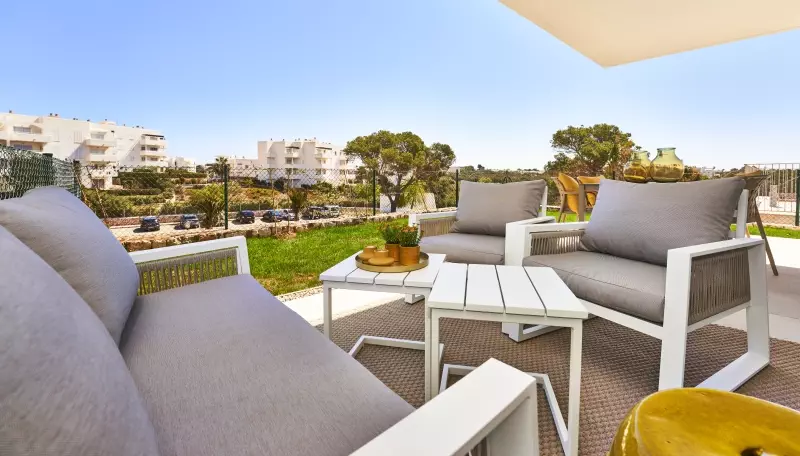 A new build apartment in Cala d'Or with a balcony and a view of the city.