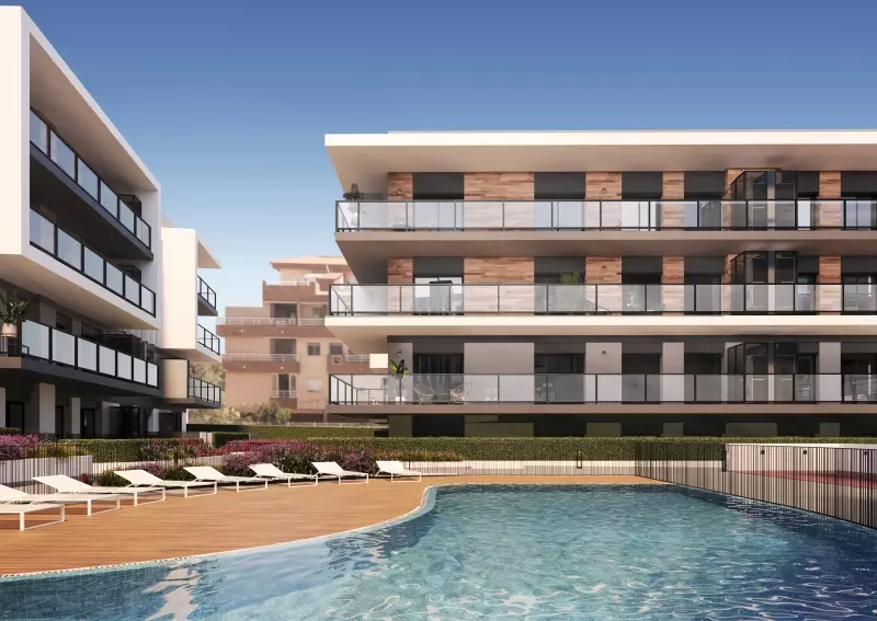 A rendering of a new build apartment complex with a swimming pool for sale in Alicante.