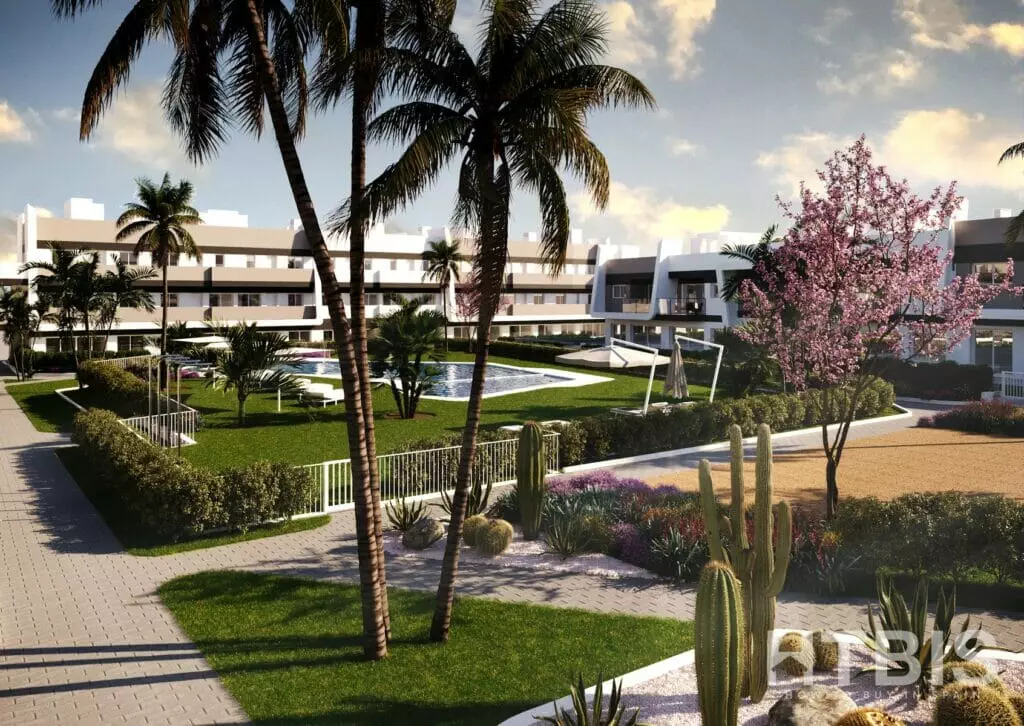 A 3D rendering of a Gran Alicante new build apartment complex with palm trees and cactus.