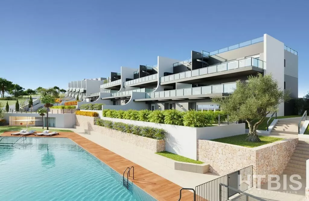 A modern apartment complex with a swimming pool, offering cheap Alicante property for sale.