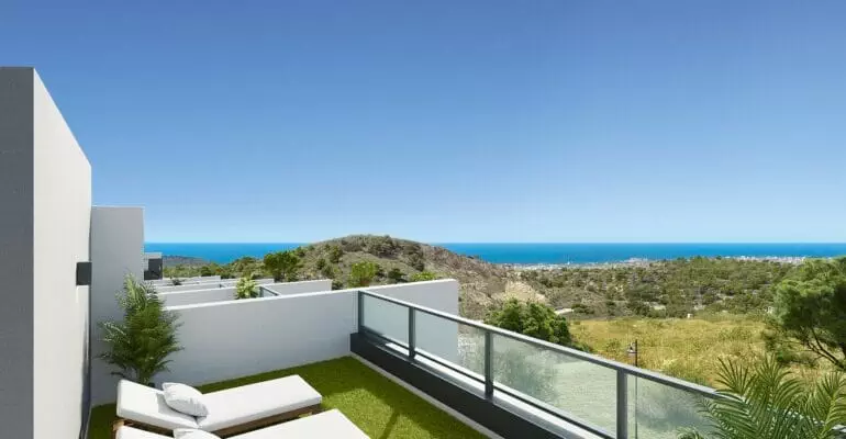 A modern Benidorm new build apartment with a balcony overlooking the sea.