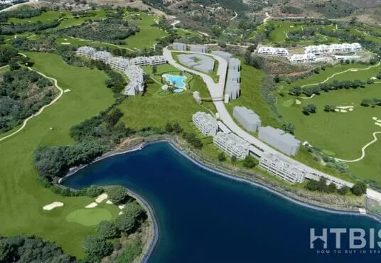 An aerial view of a golf course and a lake, with Malaga New Build Apartments in the background.
