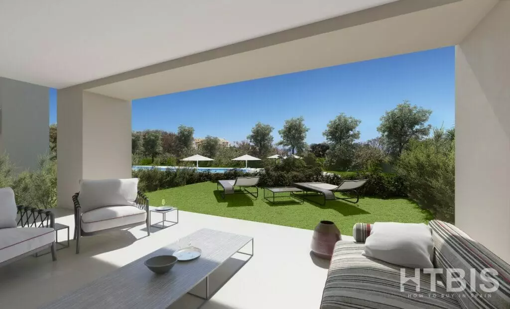 A rendering of an apartment in Estepona with an outdoor living area including furniture and a view of a golf course.