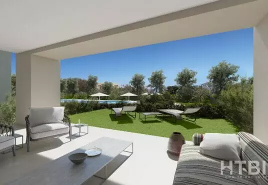 A rendering of an apartment in Estepona with an outdoor living area including furniture and a view of a golf course.