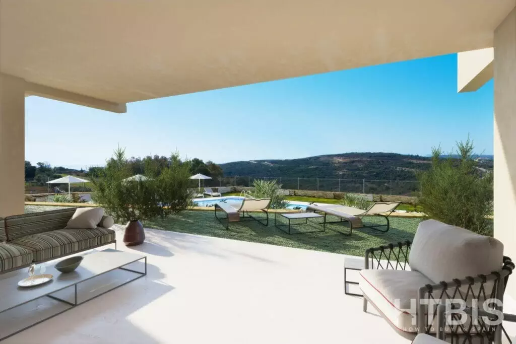 A large patio with furniture and a view of the Estepona mountains.