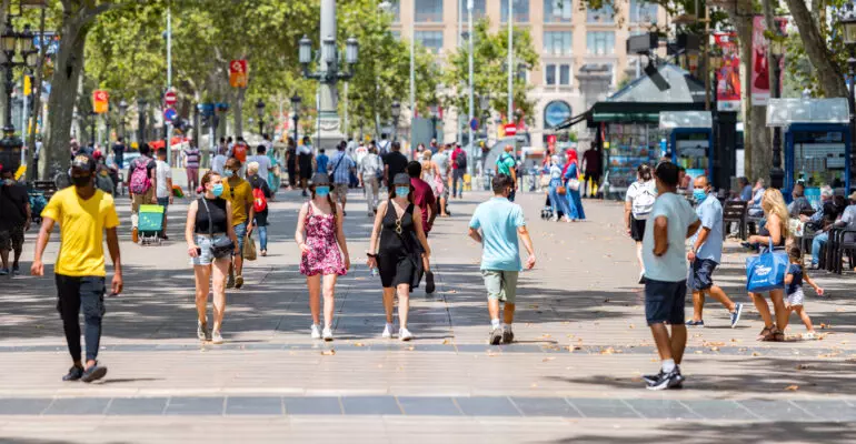 People walking through empty streets after COVID 19 in Barcelona, Spain.