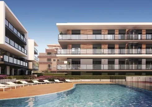 A rendering of a new build apartment complex with a swimming pool for sale in Alicante.